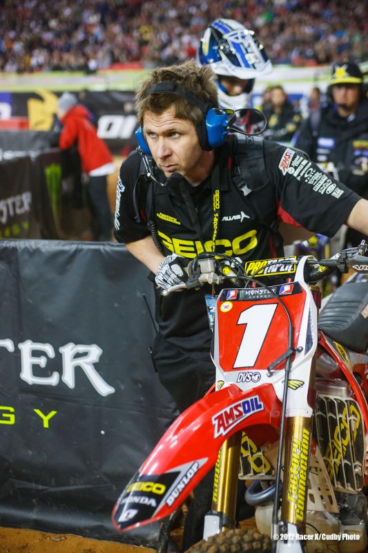 Schnikey rolls Barcia's bike to the start