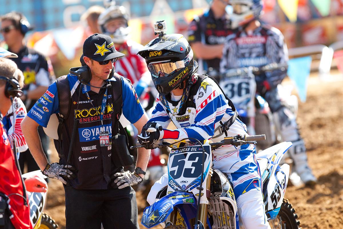 Ryan Sipes talks with his mechanic.
