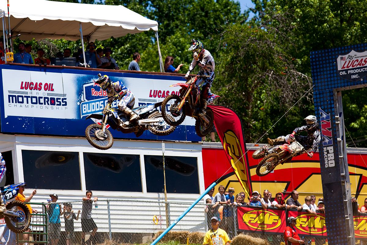 Peters, Nelson, Harrison over the finish table top.