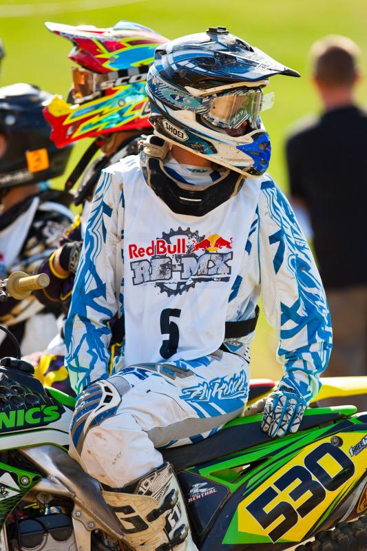 Waiting for his teammate to cross the finish line.