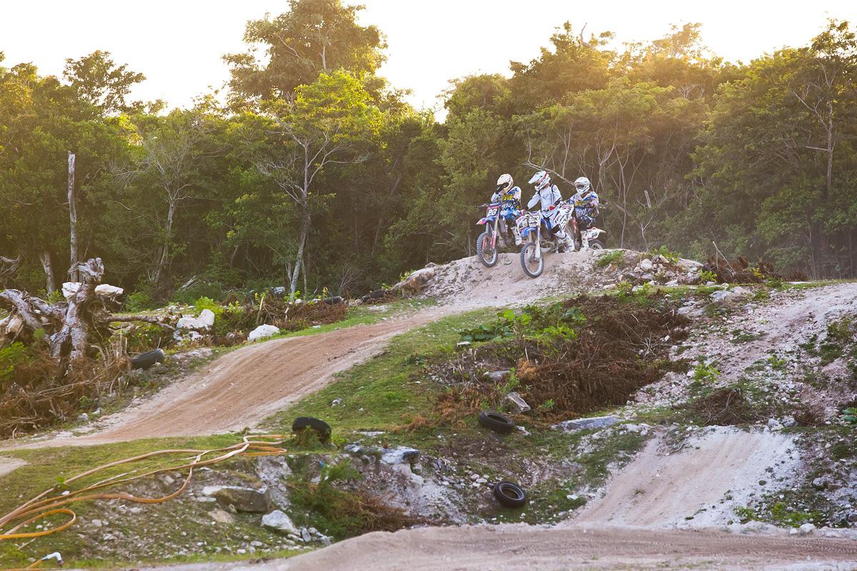The group sits at the top of the downhill triple. 
