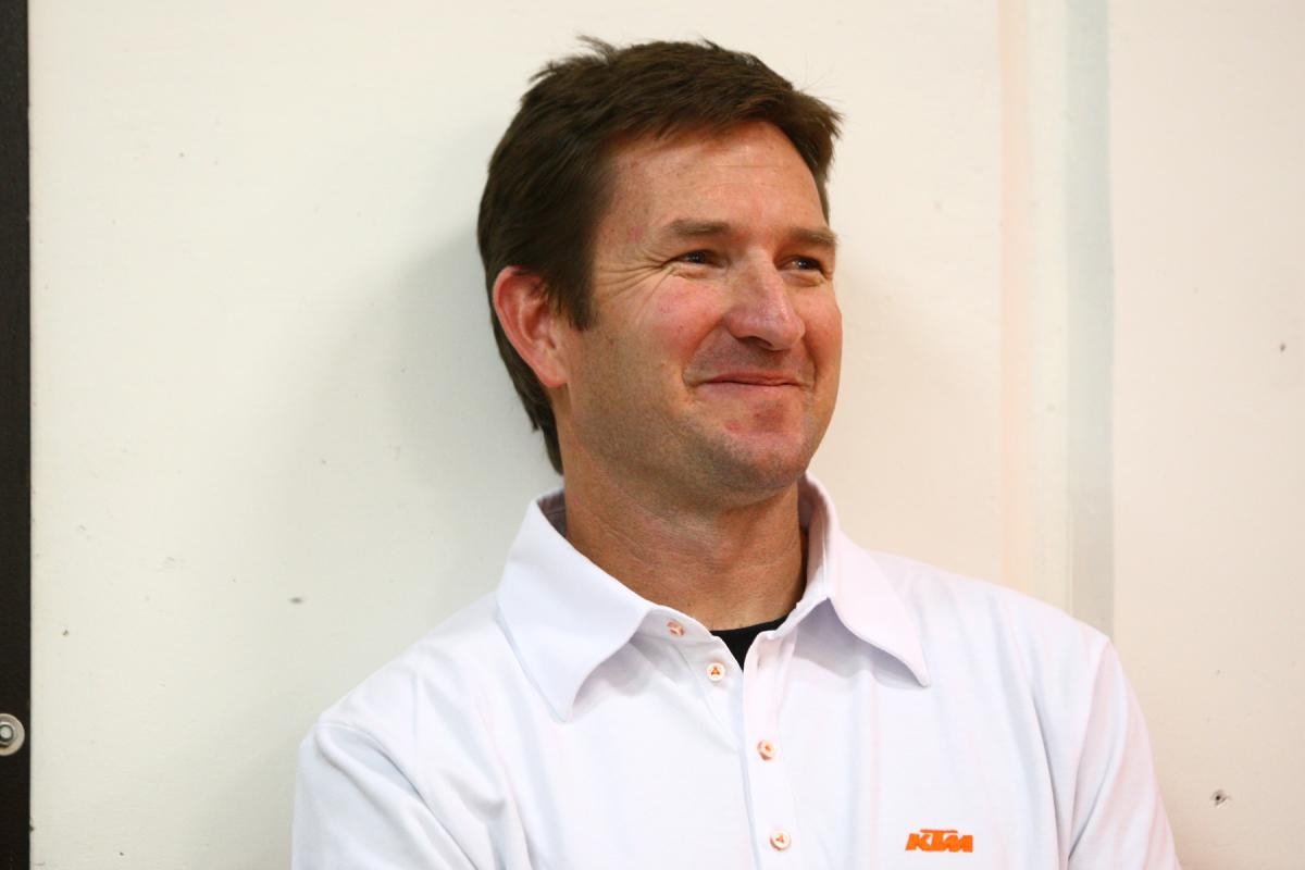 We could say Ian Harrison looks exceptionally happy, but he's always smiling.