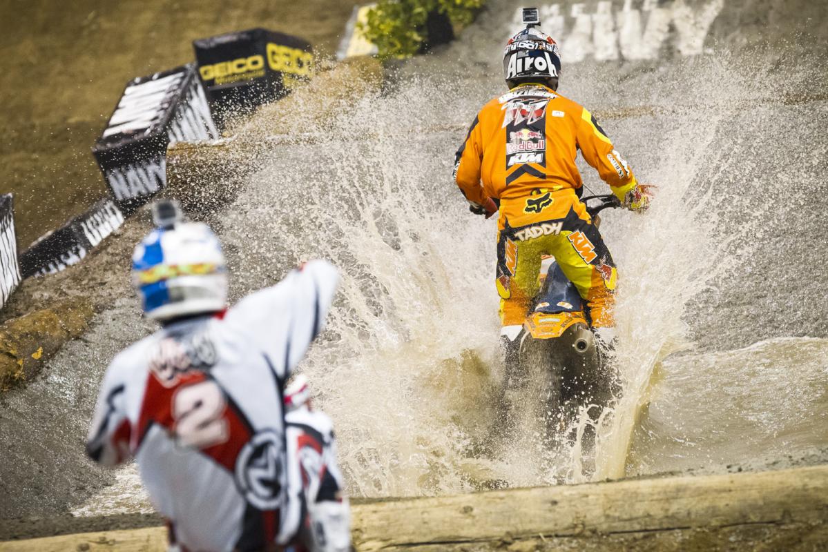 Taddy Blazusiak splashes through a massive water section, one of several challenging obstacles on the course. Amazingly enough, the entire circuit is built overnight after the Moto X racing, and features two water pools, several rocks and logs, and even step-ups and double jumps. 