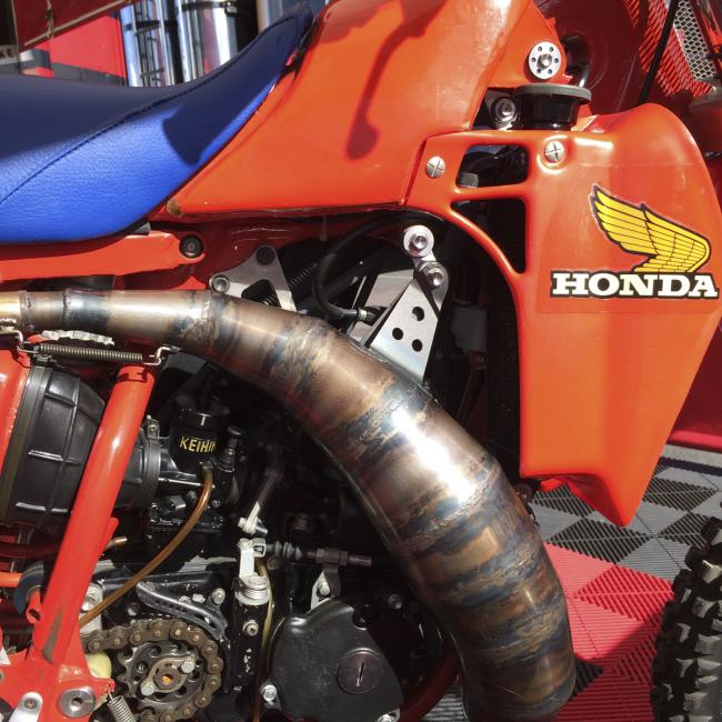 The right side of the bike shows off the cone pipe--a dizzying number of combinations could be tried. Note that the paint scheme of the left side tries to match the look of the actual tank on the right.