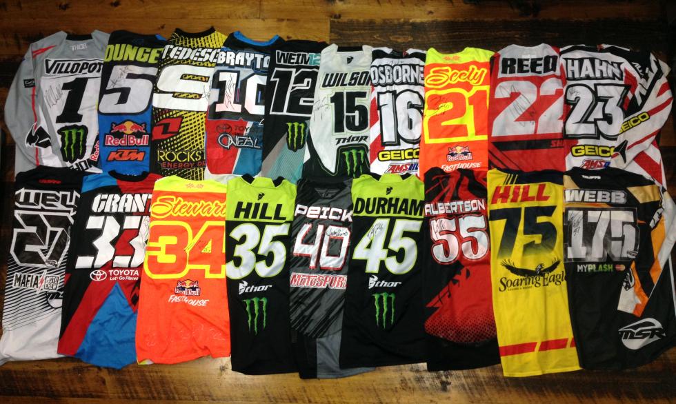 All these jerseys and more are being auctioned off to benefit Tiger Lacey's family.