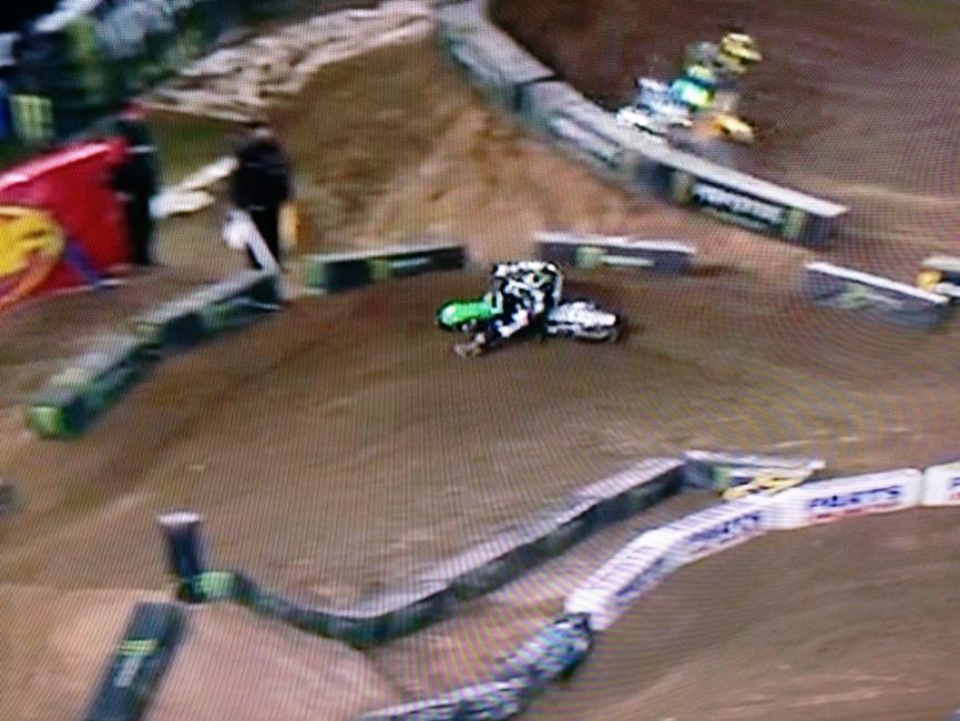 Chad is far to the left coming into the berm so he has to make an extremely sharp turn. This sharp angle causes him to slow considerably and rely on the far outside line to make his arc.