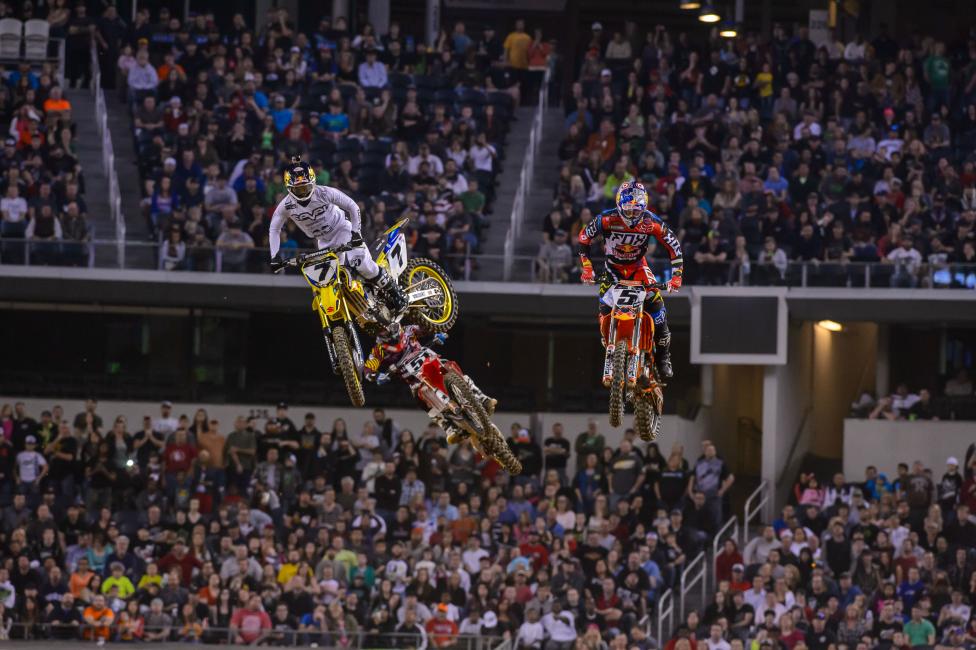 James Stewart (7) used the rhythm section after the finish line to distance himself from Ryan Dungey (5). 