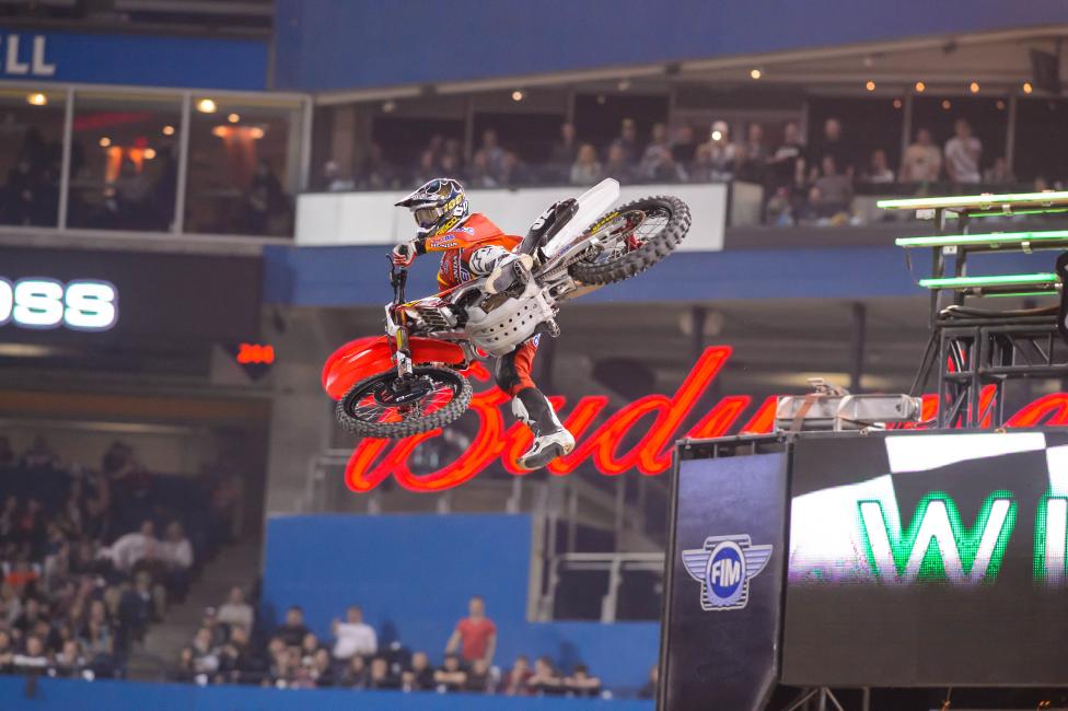 Bogle celebrates his first win with his classic one-legger.
