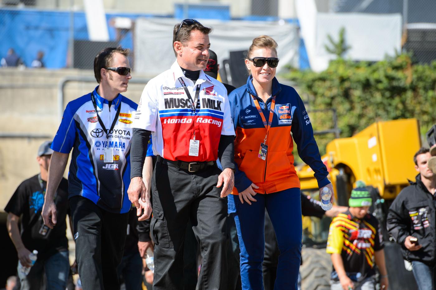 JGR' engine builder Shawn Ulikowski, Honda Muscle Milk Manager Dan Bentley and Steph Nutt on a track walk.