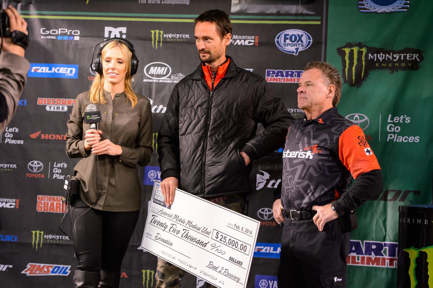Podium emcee Ashley Phillips, Road2Recovery's Jimmy Button and Asterisk Medical's Dr. John Bodnar.