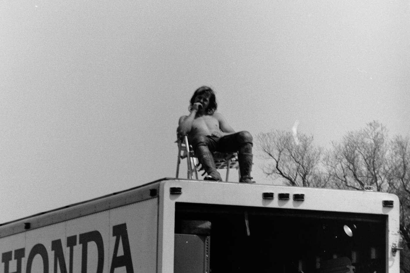 Team Honda's teenaged superstar Marty Smith surveys the crowd from above his box van. He won the first 125 National as well as the '74 championship.