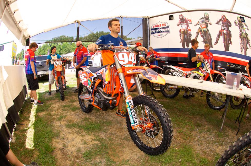 Ken Roczen's mechanic Kelly Lumgair takes his bike through tech today.
