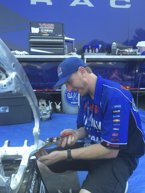 Adkins works on Pourcel's bike following the Budds Creek National. 