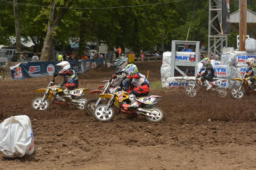 The mini kids battle down the first turn.  