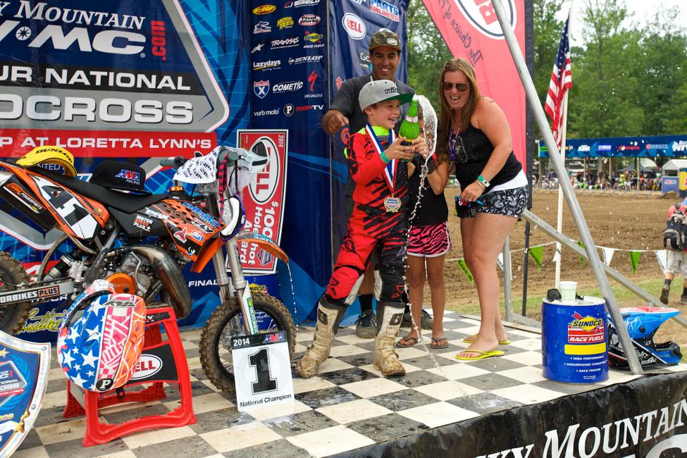 Nick Romano celebrates a 50cc title with family—in this sport, by the time a rider is eight-years-old, they've already got a rep, style, and support.
