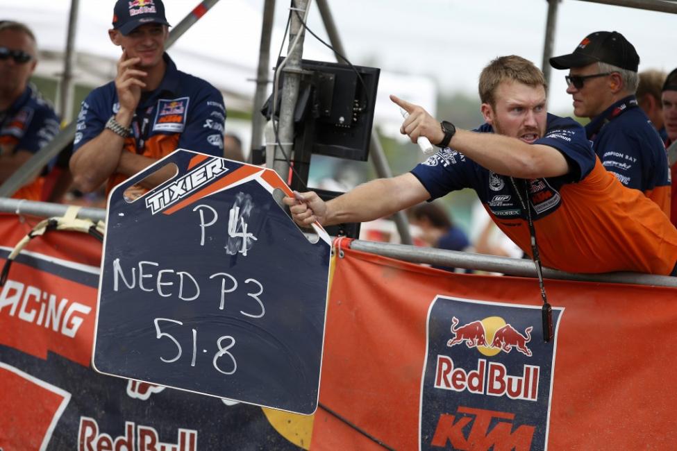 Tixier's mechanic (above) let's him know he needed one more position in the second moto Sunday to capture the championship. 