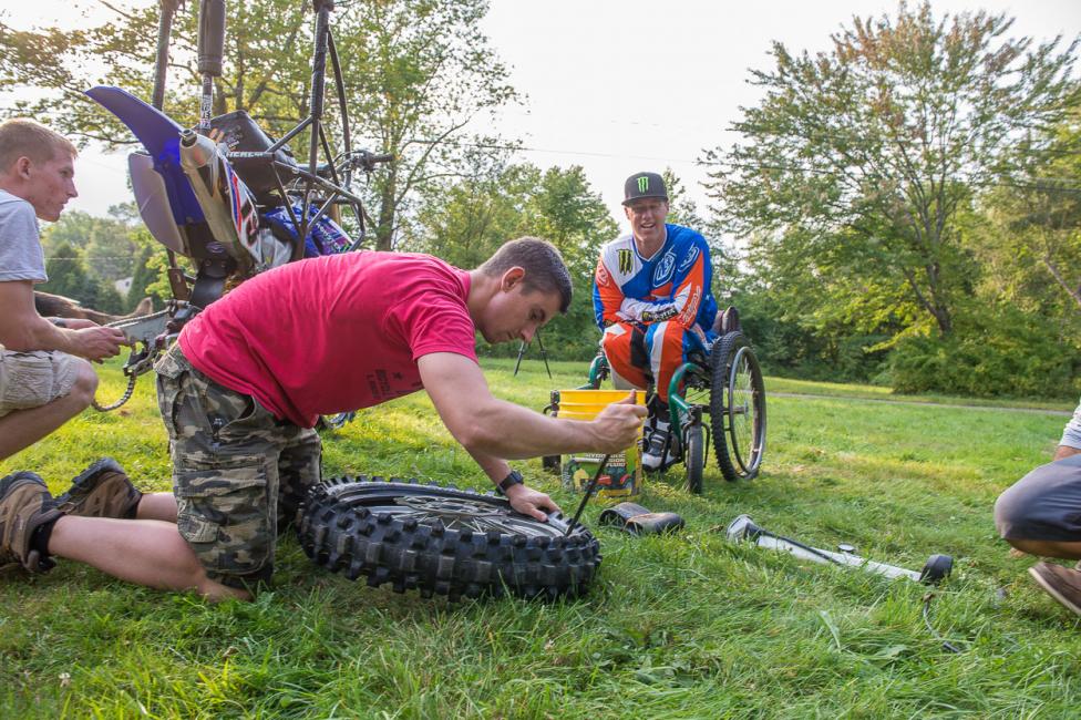 Doug Henry watches Dirt Rider’s Chris Denison doing some manual labor as part of his magazine guest editorship.
