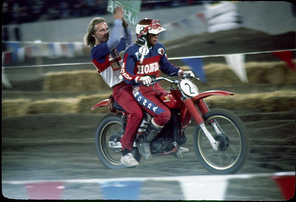 Marty Smith and his mechanic Dave Arnold celebrate their Pontiac Supercross win.