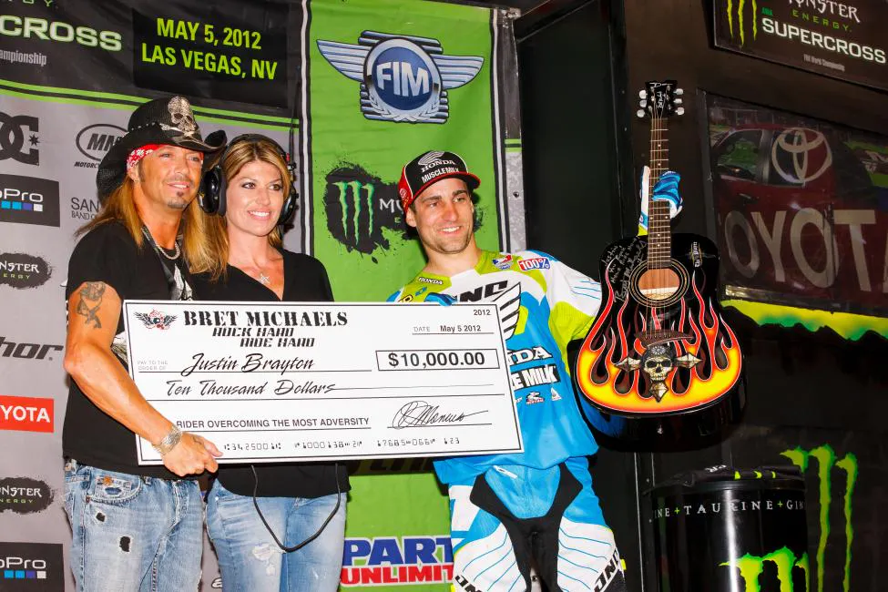 Yup, that’s Brett Michaels, of the rock band Poison, presenting Justin Brayton with the Rock Hard Ride Hard Award. We don’t know if Brayton plays guitar, but he did come back from a broken leg early in the season.