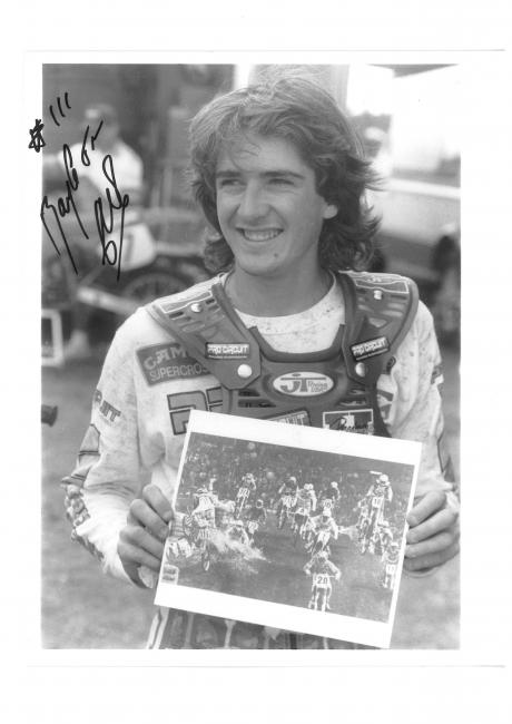 Jean-Michel Bayle holds up a photo of his Anaheim 1 crash, shot by Fran Kuhn.