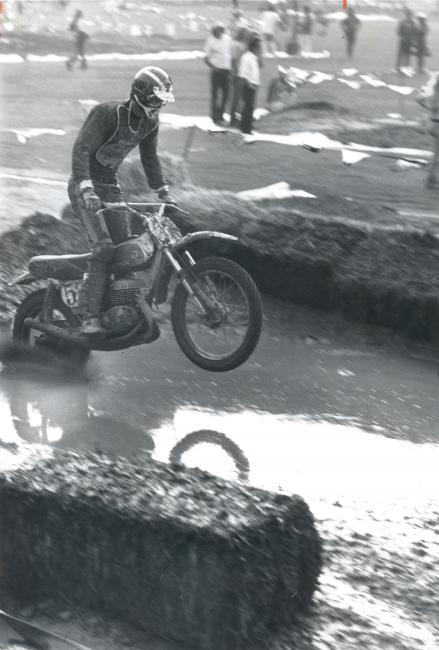 Jim Pomeroy splashing through a manmade waterhole on his Bultaco, 1973 Superbowl of Motocross at the Los Angeles Coliseum.