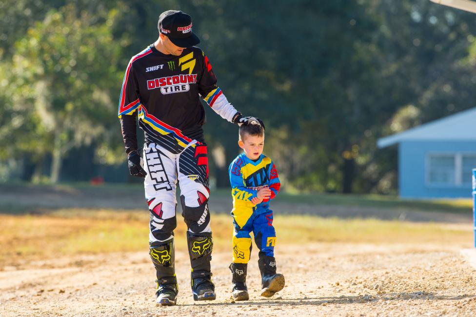 Tate has started racing moto, and often joins Chad on his bike as part of the supercross opening ceremonies.