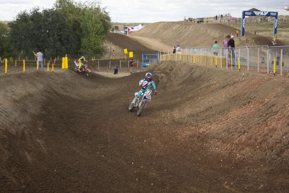 ...While his brother Alex shoots straight down the middle and rides wide around the outside of the exit.