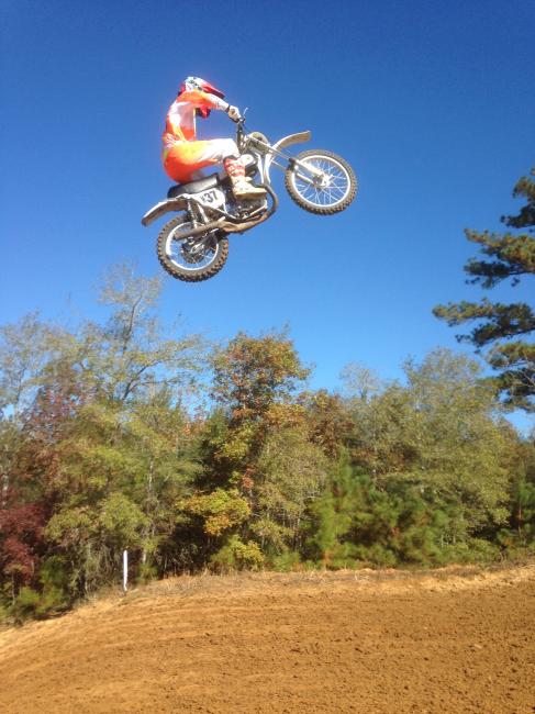 Kevin Windham launches his step-up triple on a Team Bull Bultaco (circa '74) at last year's Party in the Pasture.