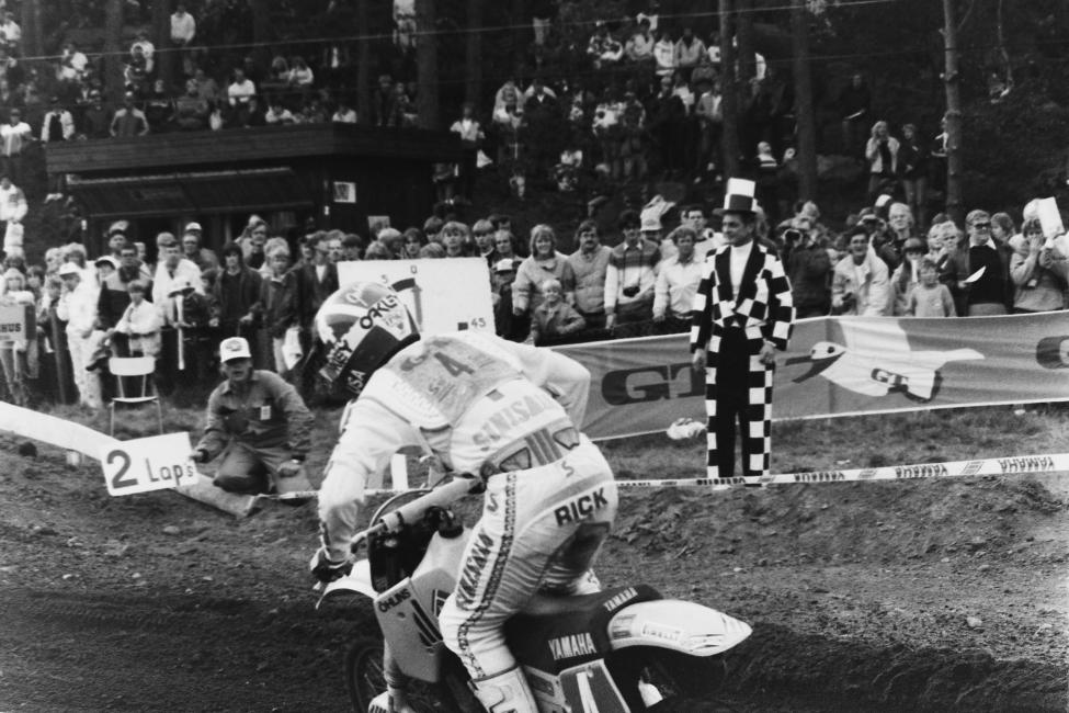 Johnson gets the two-lap signal as he passes the best-dressed flagman of all time. Disappointed with his debut, RJ’s best years in this race were yet to come, and there would be many!