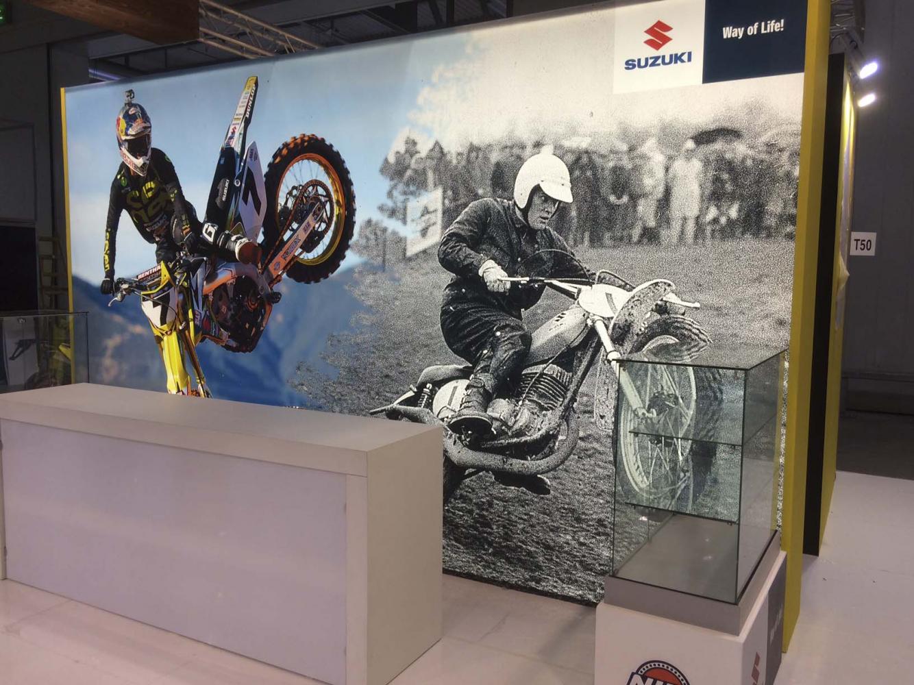 Suzuki's display goes then and now with James Stewart and six-time World Champion Joel Robert.