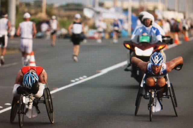 This photo was about 11 miles into the final leg of the Ironman. Jason is about to put the hammer down and I'm about to run out of gas!