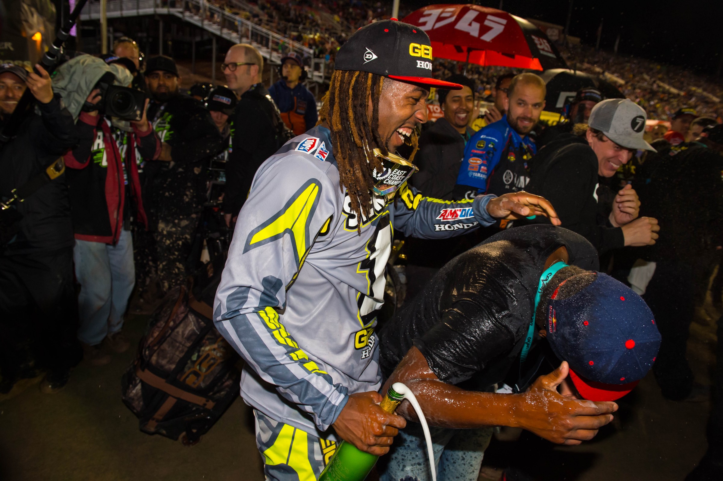 Malcolm (left) celebrates his first career title with his brother James.