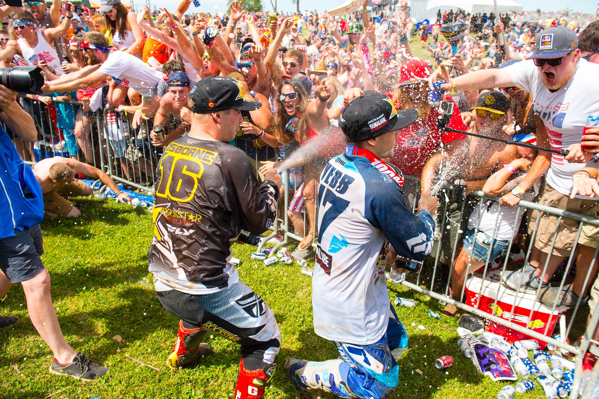 Osborne and Webb celebrate a podium.
