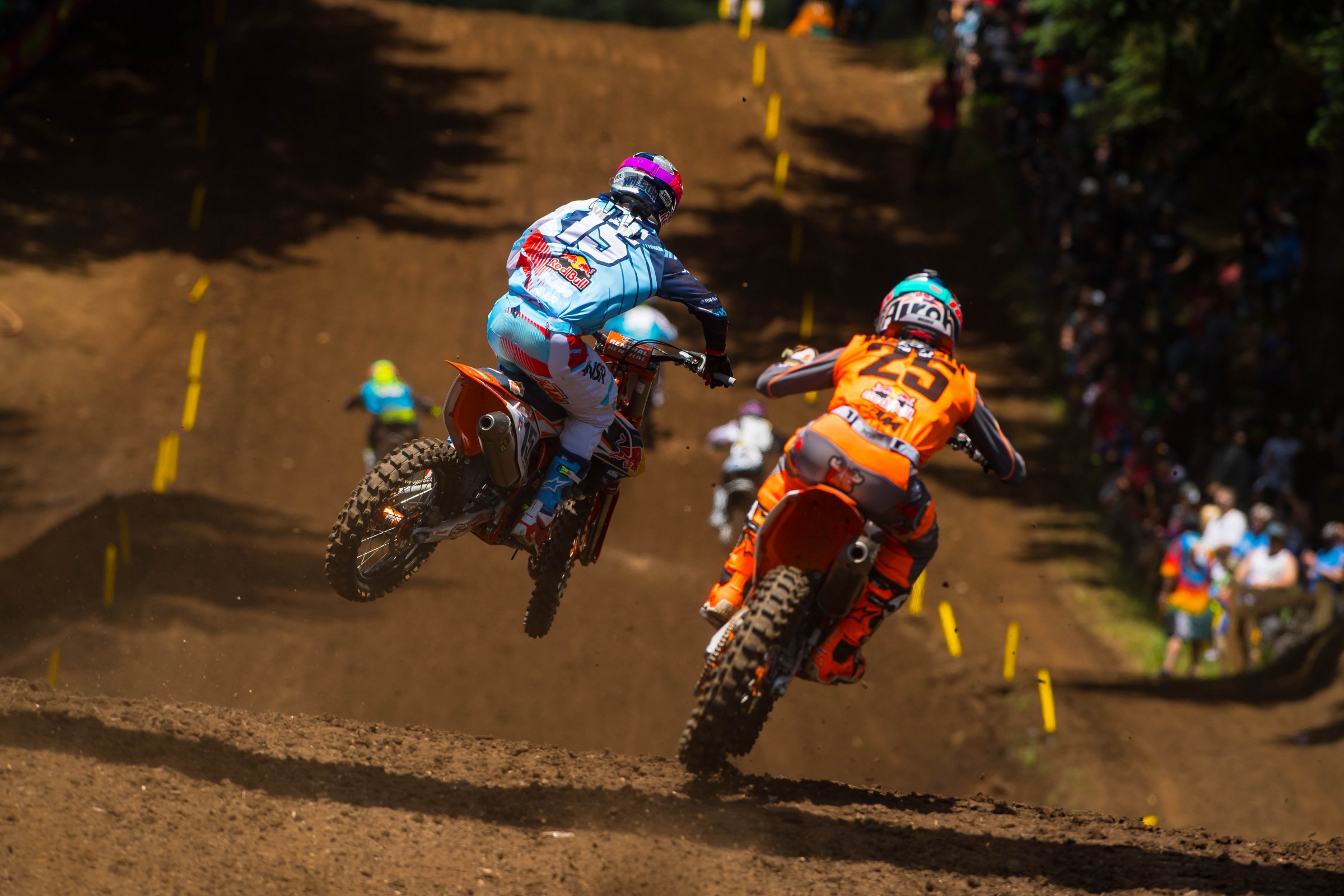 Marvin Musquin (25) gets up close and personal with teammate Dean Wilson.