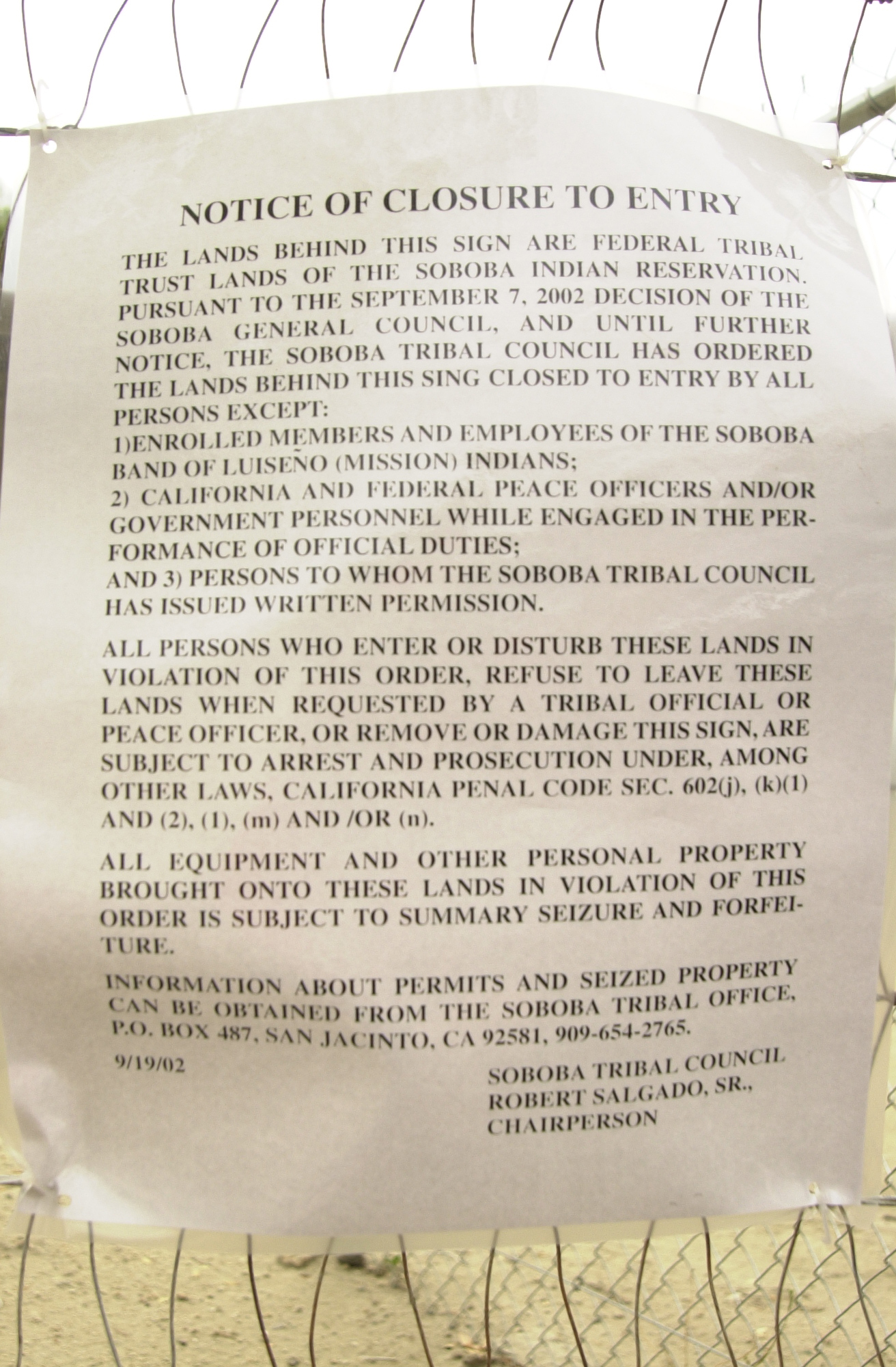 The closure notice posted on the fence near the front gate.