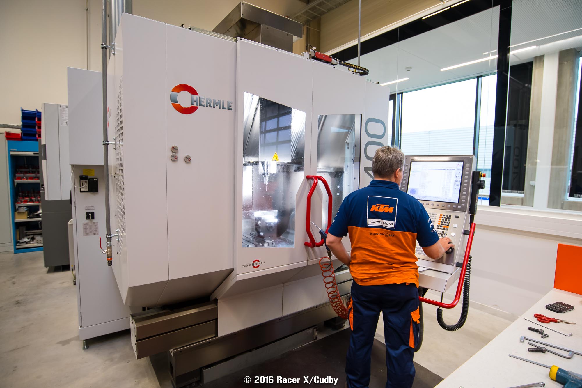 Deep inside the race shop itself, there are CNC machines to build custom parts on demand.