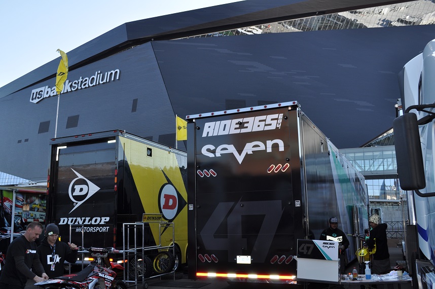 Guys working on bikes stuffed between semis is common.