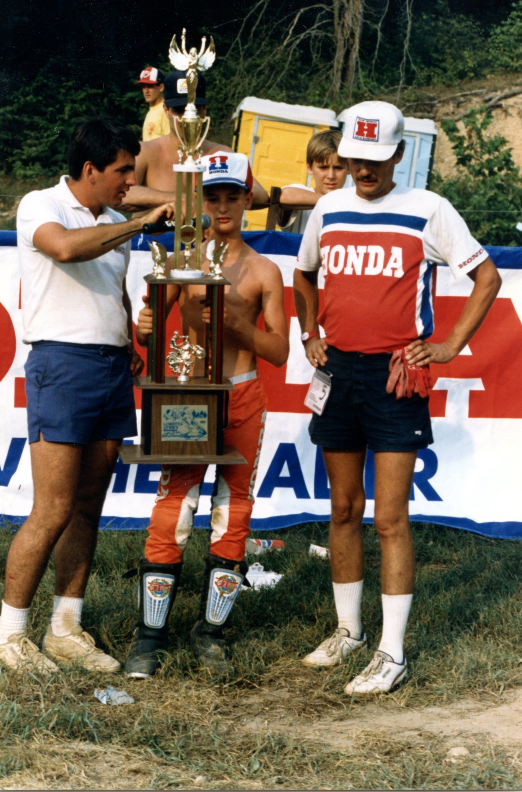 Tim Cotter (left) presenting Jimmy Button and his father with the 85 (12-13) Stock trophy.