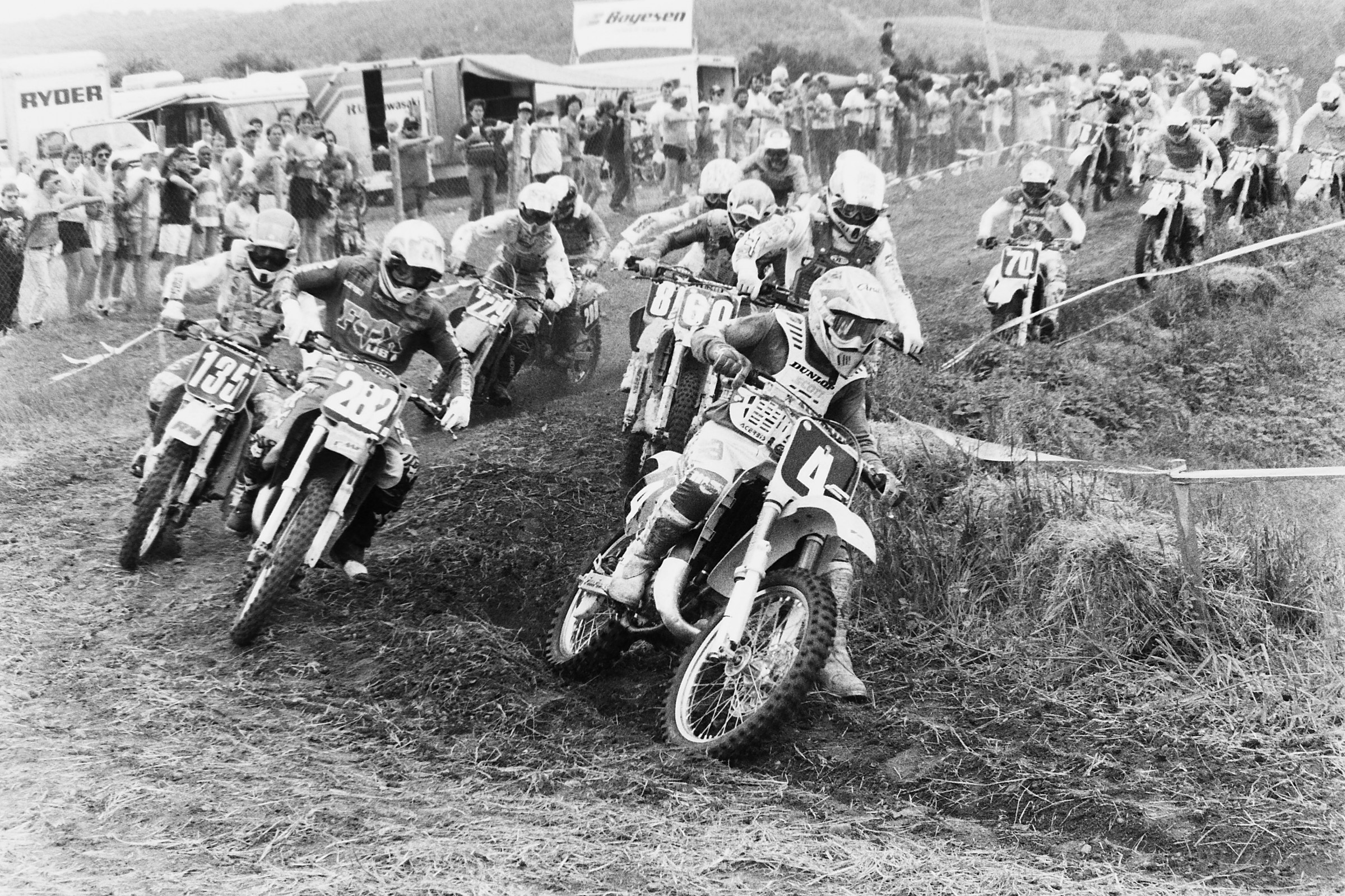 Guy Cooper (4) won the first moto of a very competitive 125cc Support race over Jean-Michel Bayle