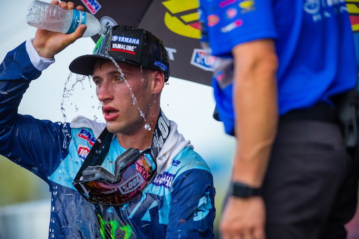 Justin Cooper, Florida's 250 Class overall winner, dumps water on himself following a moto.