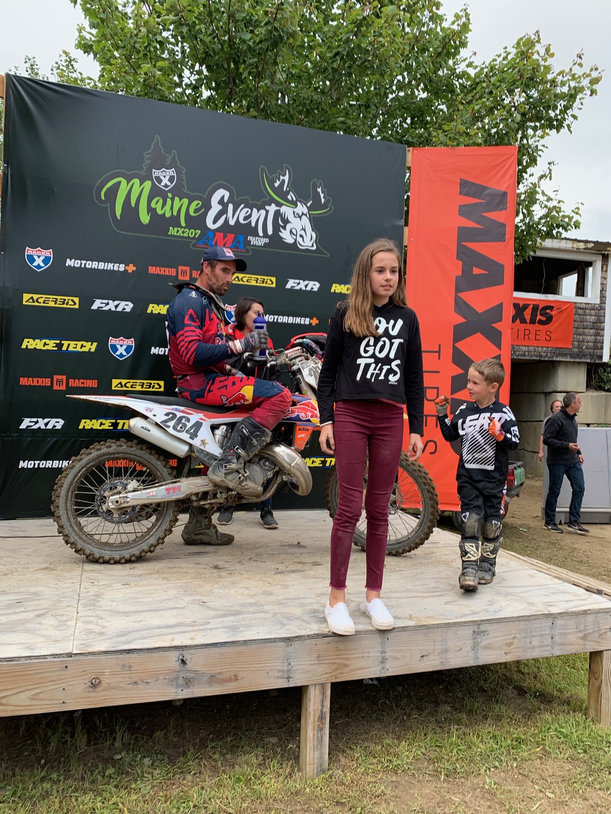 Sipes on the podium with his kids.