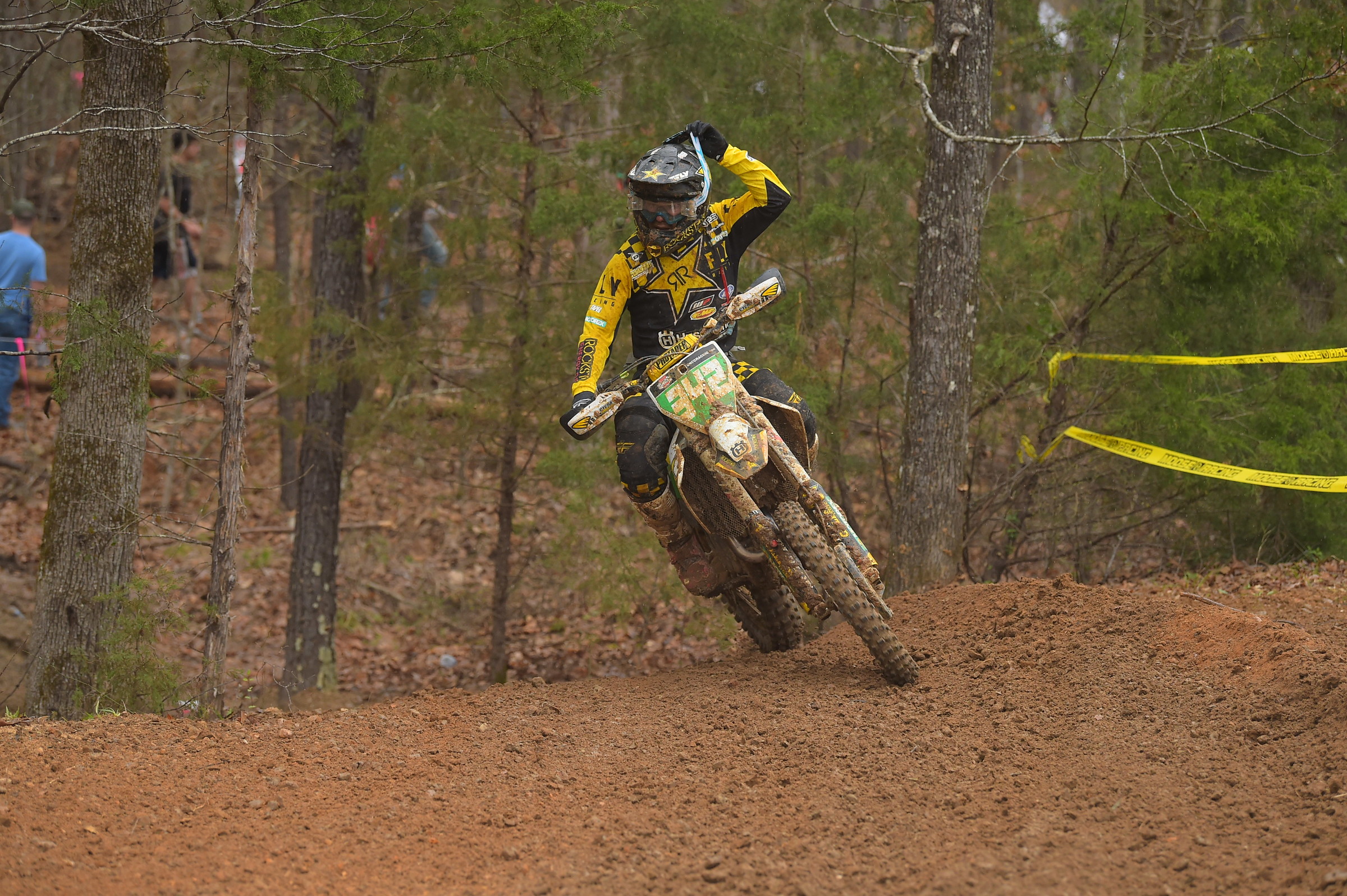 Rockstar Energy Husqvarna's Craig Delong doing the ole' mid-race goggle toss. Step one: remove goggles.