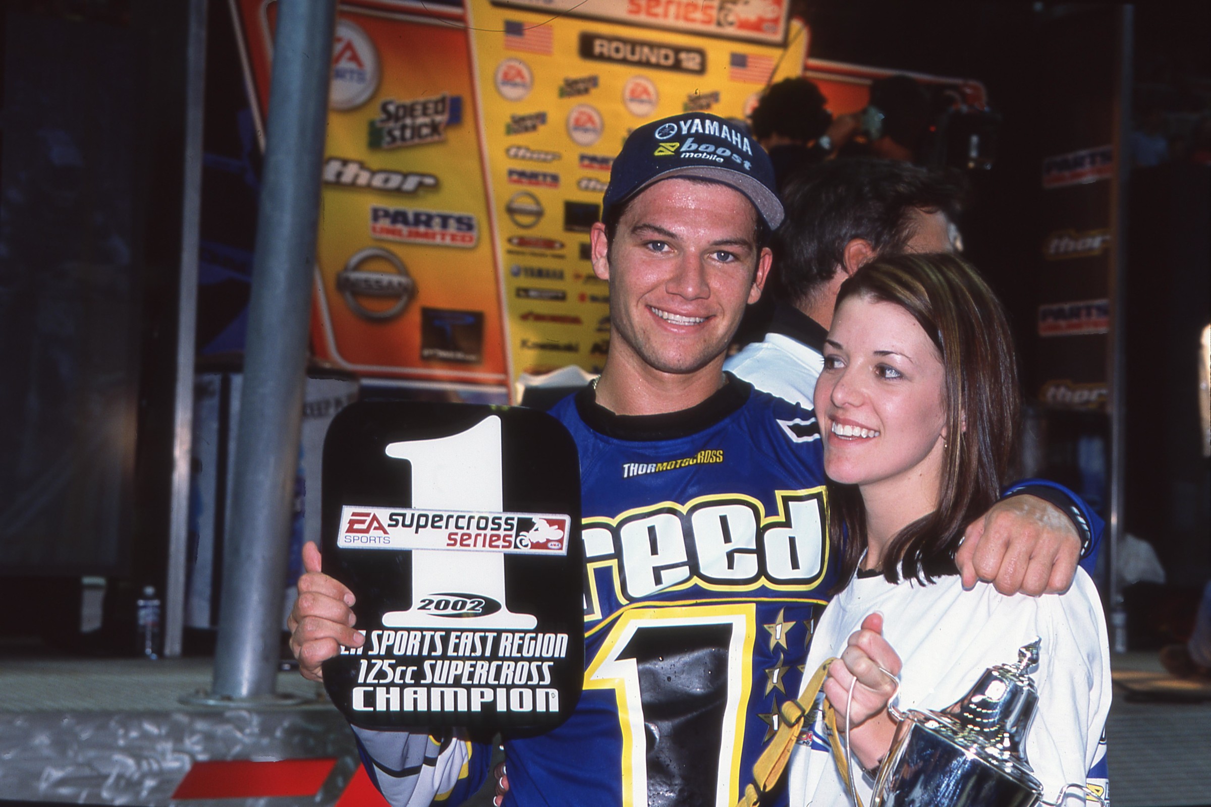 Chad and Ellie celebrating his 2002 EA Sports 125SX East Region Supercross title.