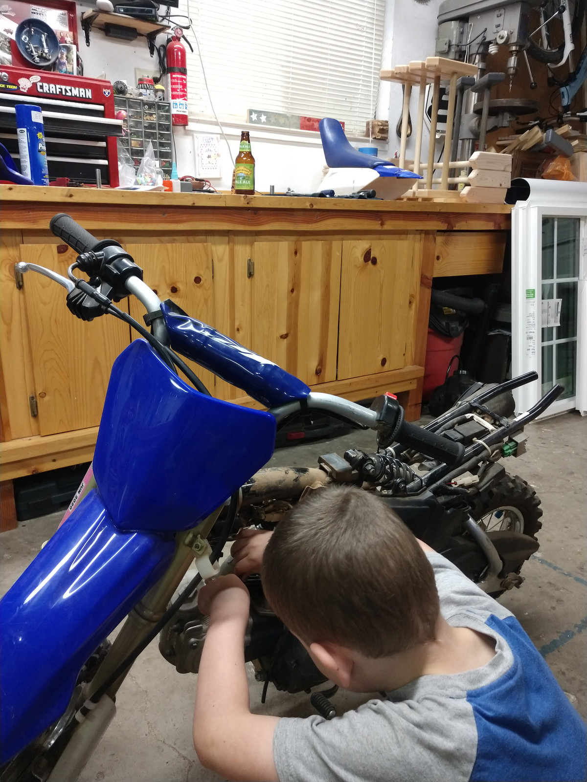 Calvin's gonna have the Yamaha TT-R50 ready for summer in no time!