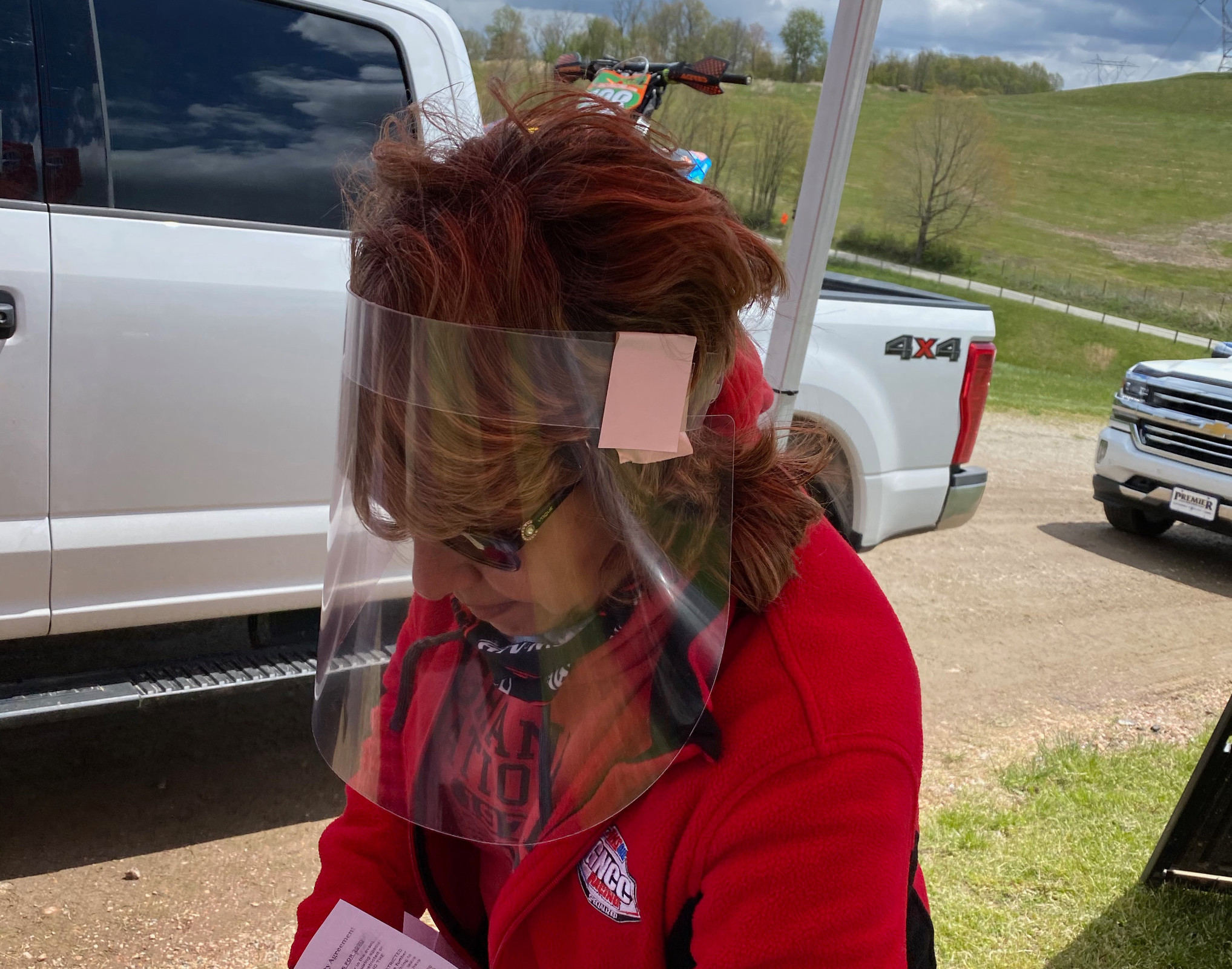 Melissa Holbert ran a shield at High Point’s front gate. 