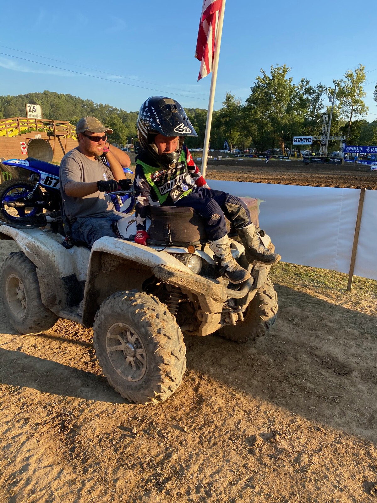 Zach gives Jacob Mariner a lift off the track.