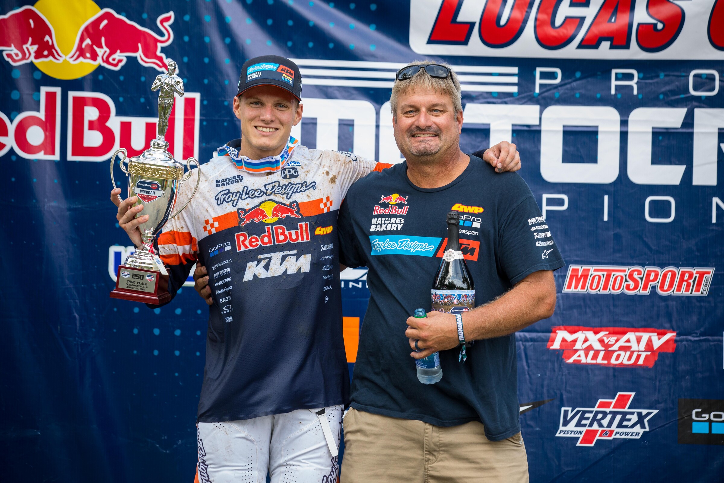 Brandon and his father, Skip, on the podium.