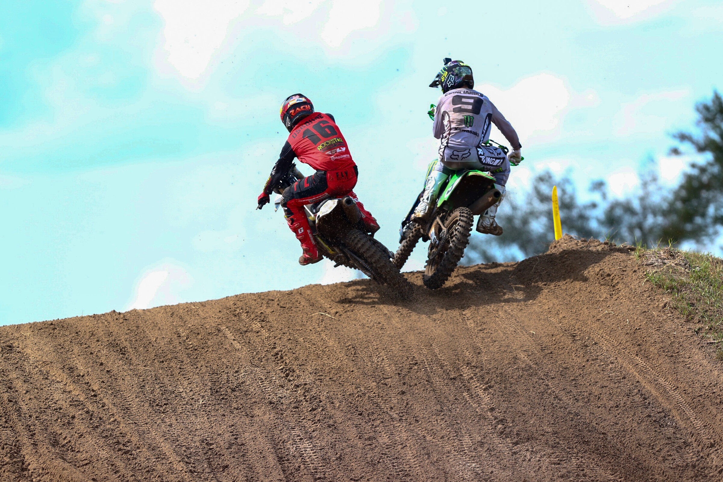 Zach Osborne and Adam Cianciarulo take off of a jump side-by-side in the first 450 Class moto at WW Ranch Motocross Park.