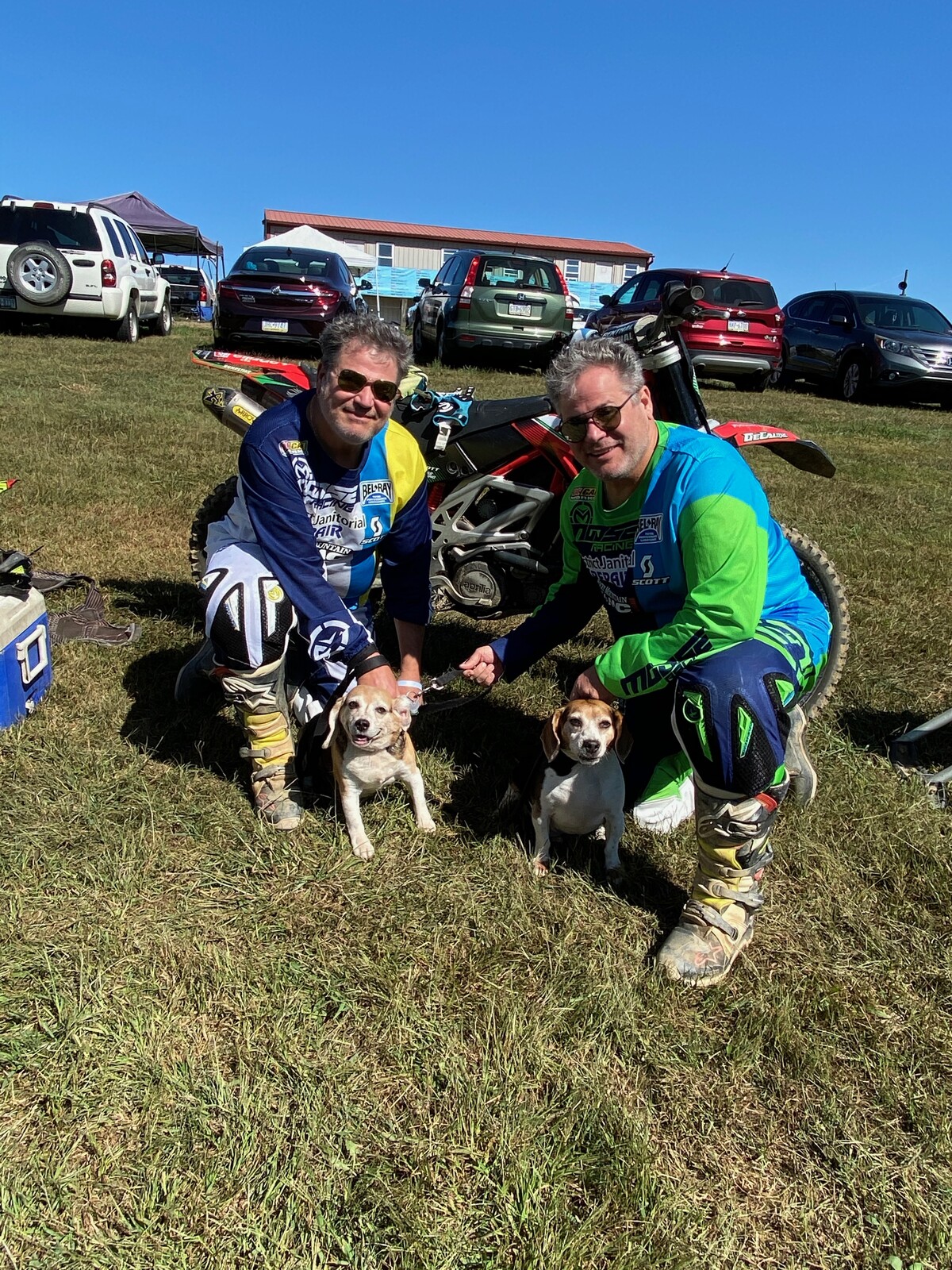 Twin racers Tim and Tom Whitehair even have matching pups!