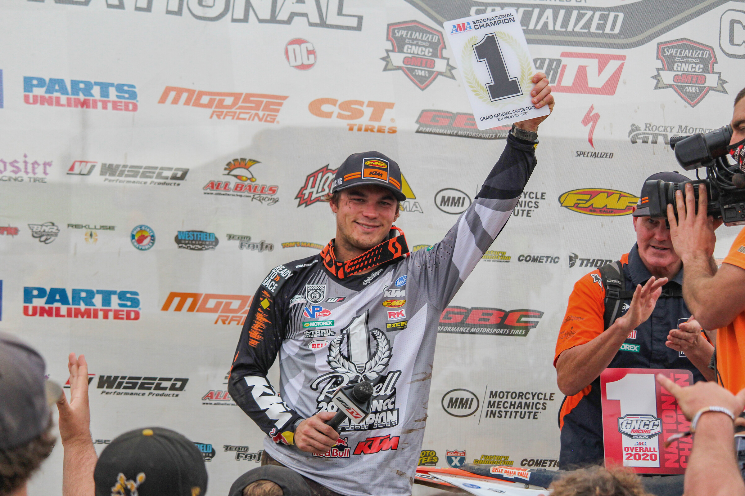 Kailub Russell hoists his eighth #1 GNCC Grand National Championship plate.